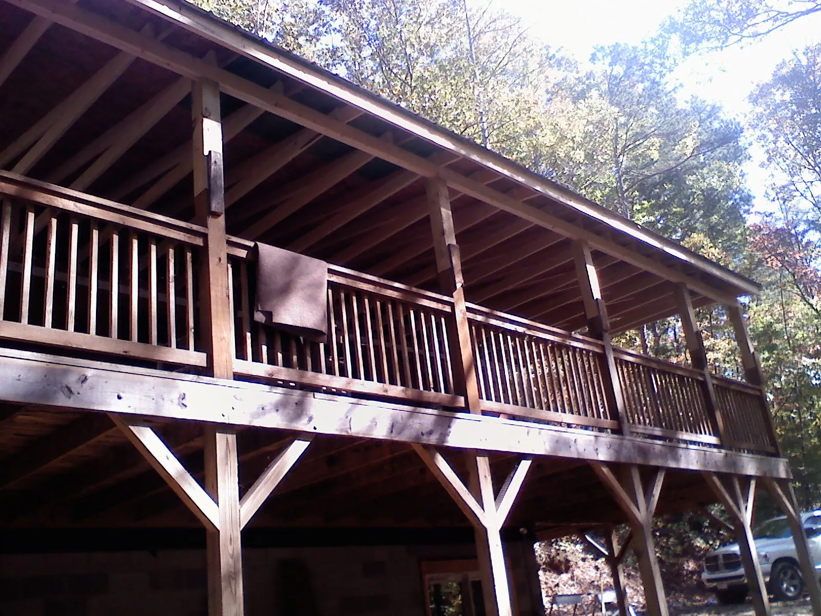 Timber framing under a new elevated porch and deck — Roof Leak Repair in South Gardiner by Roofing Brothers